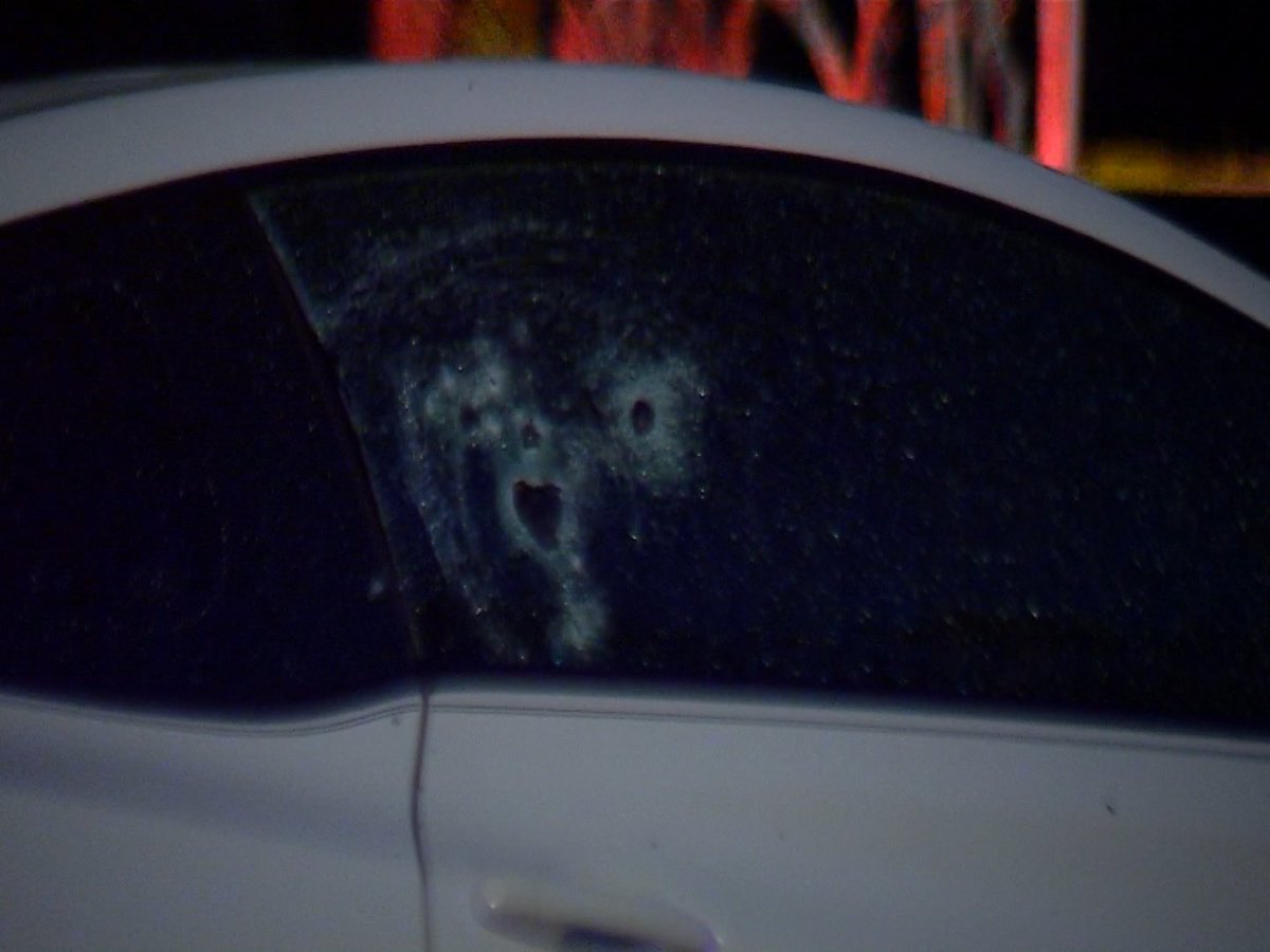 Here's a closer look at the bullet holes on the Hyundai. This is all on the passenger side door and window.