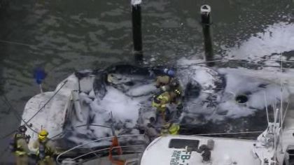 A boat docked at a Miami marina was destroyed after catching fire on Thursday morning