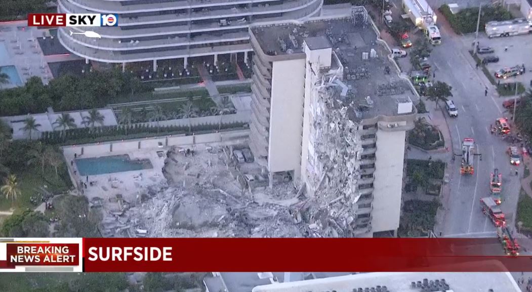 A zoomed out view of the partial building collapse in Surfside Florida. Miami-Dade Fire Rescue officials say at least one person has been killed. Surfside, Florida - Florida news today on live