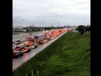 Hundreds of people gathered at an I-95 overpass near Okeechobee Boulevard in West Palm Beach to voice their support for the Cuban people amid protests on the island nation. 