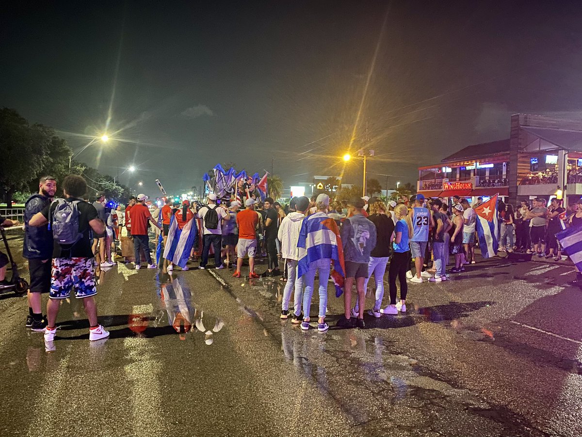 A large crowd stands in solidarity with protests in Cuba. Police closed Columbus Drive to traffic from Dale Mandy to Himes. Cuban flags, chants, and honking in this 10 pm hour