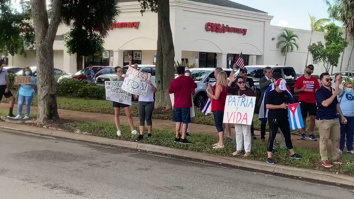 Drivers honked in support as they passed the dozens of people at the intersection of NW 84th St. and NW 82nd Ave. in Miami Lakes who are protesting the communist-run government in Cuba
