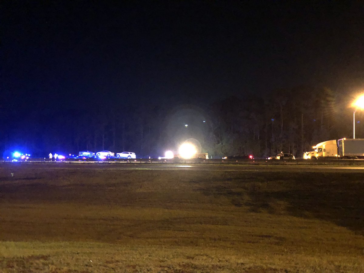 Says this is a fatality and was called in at 4:07am.  A truck towing at least 3 cars appears to be involved.  There are cars stopped behind where the road is blocked