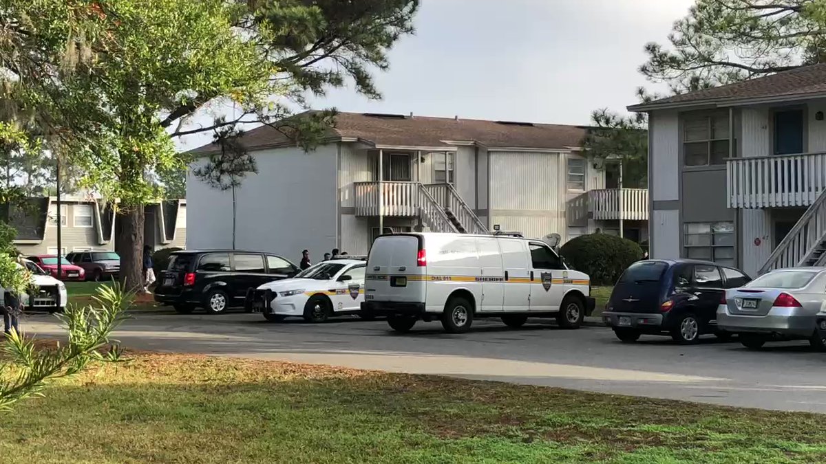 Retention pond blocked off with red police tape at Baytree On Baymeadows Apartments 