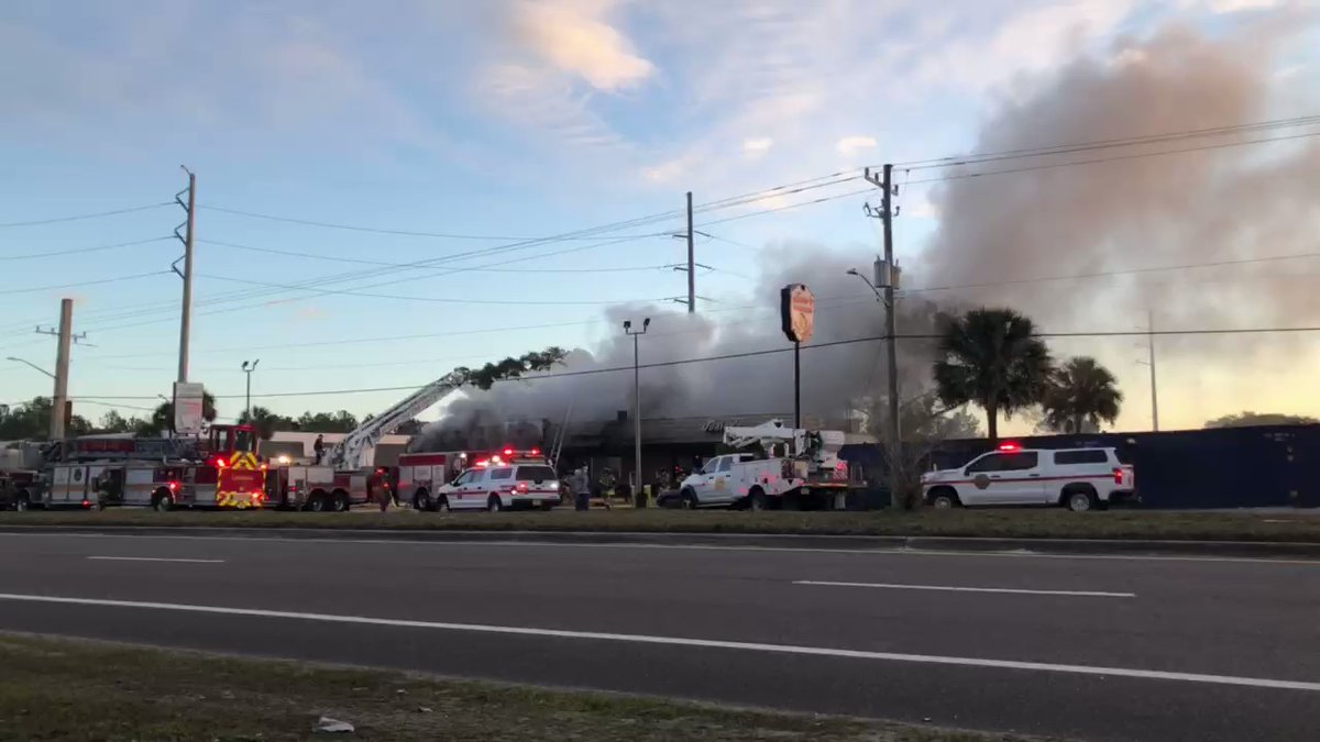 Junior's Seafood is on fire. You can smell the smoke from the highway.