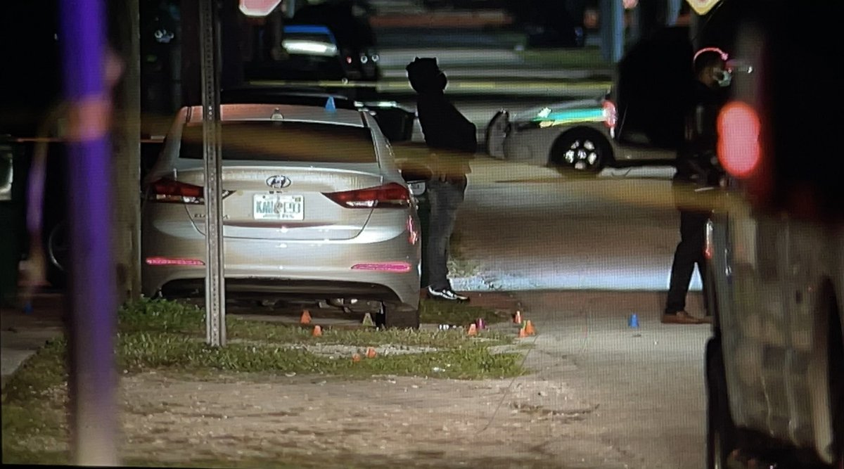 Three people injured overnight after drive-by shooting in NW Miami-Dade. @MiamiDadePD placing evidence markers near silver car on NW 58th St near 23rd Ave. Man and woman found shot at the scene. Third victim drove himself to hospital.