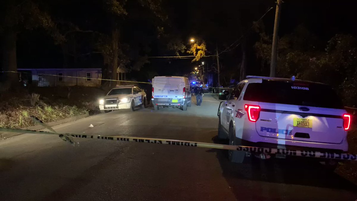 Crime scene extends down Liberty Street. Forensics units are on scene. TPD just put one young man into back of patrol car, not cuffed. Officers knocking on doors/searching yards with flashlights