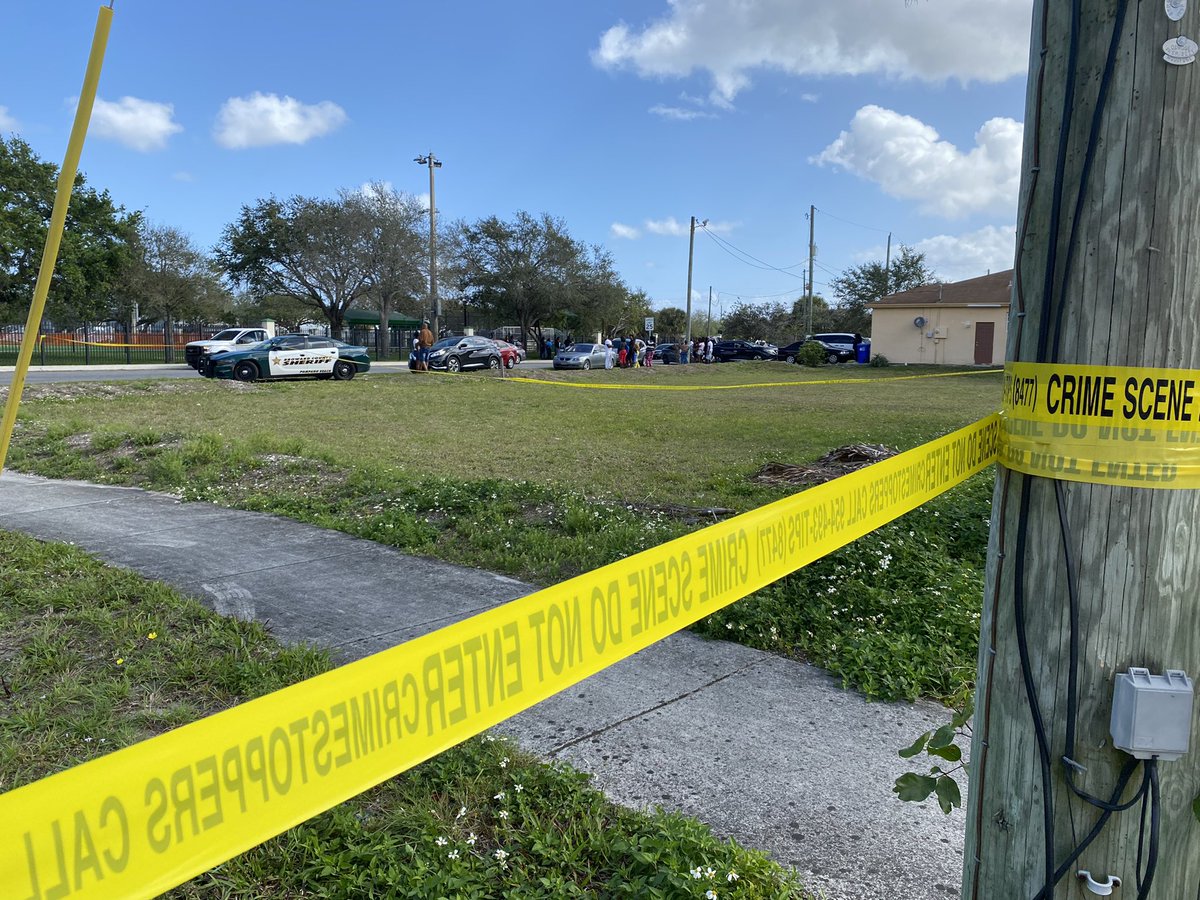 Flowers left by canal where woman and baby were rescued from a car in the water. Woman was shot to death. Infant girl was unharmed. Woman was child's godmother. Deputies now searching for suspects