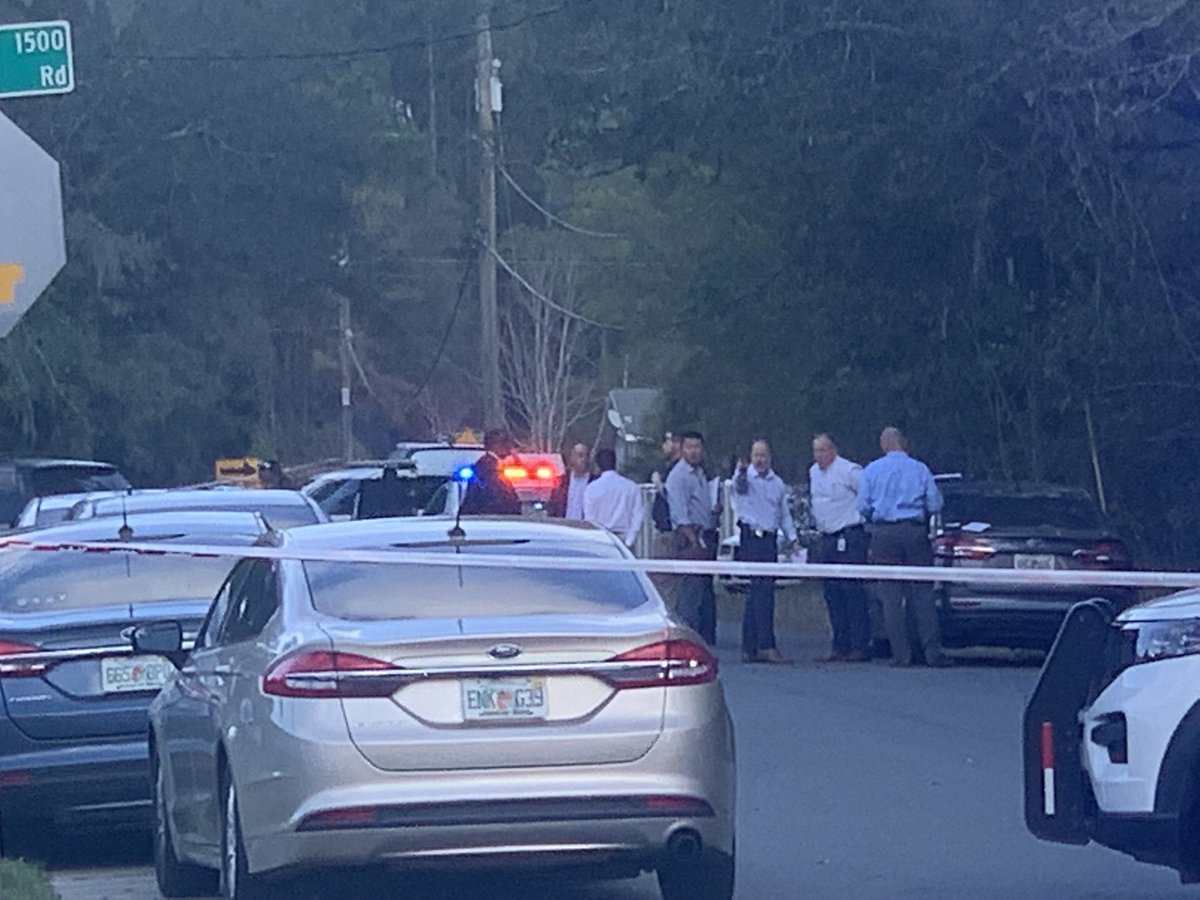 There is a very heavy law enforcement presence out here. I counted more than a dozen JSO cruisers, a crime scene unit & investigators combing the street. @wjxt4's Sky4 captured a black car riddled with bullets in the middle of this road