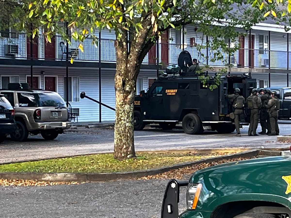 Escambia County Sheriff's Office SWAT team is in a standoff at the HomeStay Lodge motel on Mobile Hwy. as they seek a suspect with active felony warrants 