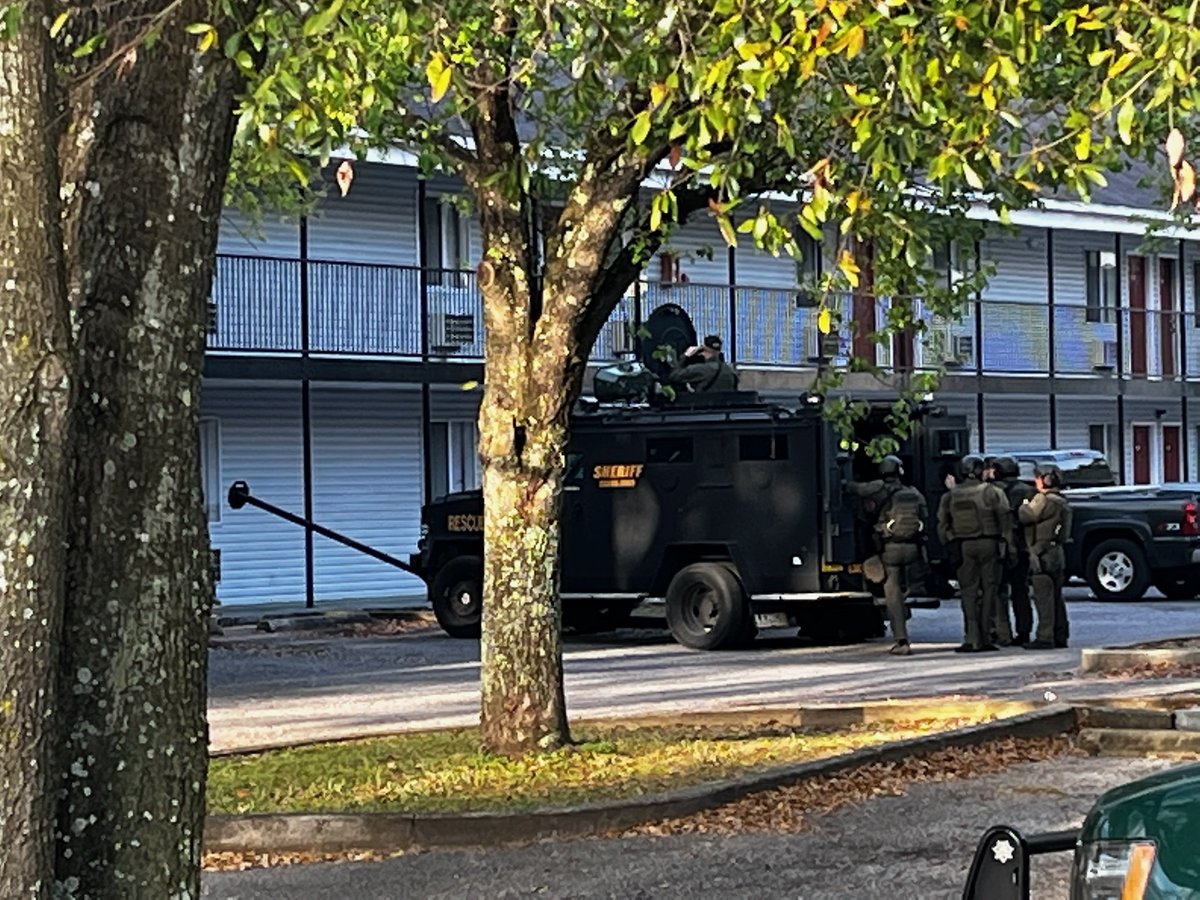 Escambia County Sheriff's Office SWAT team is in a standoff at the HomeStay Lodge motel on Mobile Hwy. as they seek a suspect with active felony warrants 