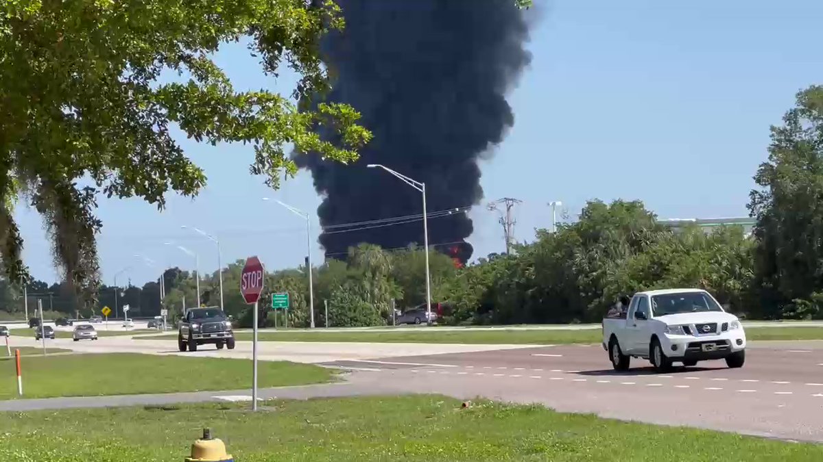 Firefighters fighting a massive Industrial fire at Port Manatee off US 41. Flames over 100 feet with explosions heard.