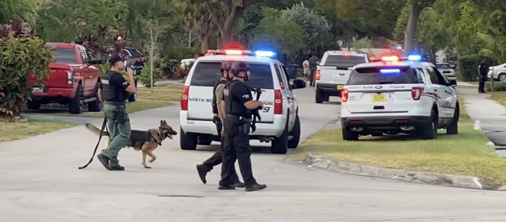 There was a manhunt tonight in North Miami. A suspected armed robber ran into this neighborhood after a clerk from a nearby store flagged down policemen. The clerk said the person came to the store two straight days