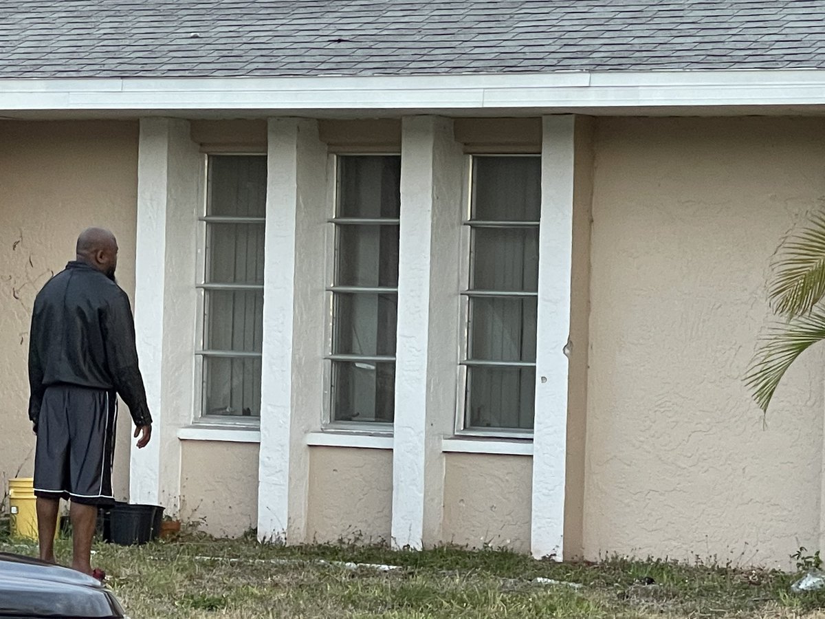 A resident at a home in the 1900 block of SE Van Loon Terrace in Cape Coral looks over bullet holes after an early morning shooting incident at the home. Cape Coral police wrapped up their on-scene investigation shortly before 7am