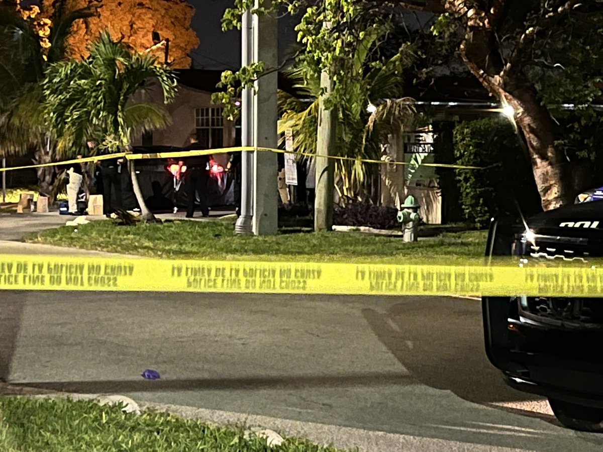 Police activity in a Hollywood neighborhood near Dixie HWY & Fillmore Street. Police are outside of what appears to be an apartment home &amp; surrounding a black tent on the ground