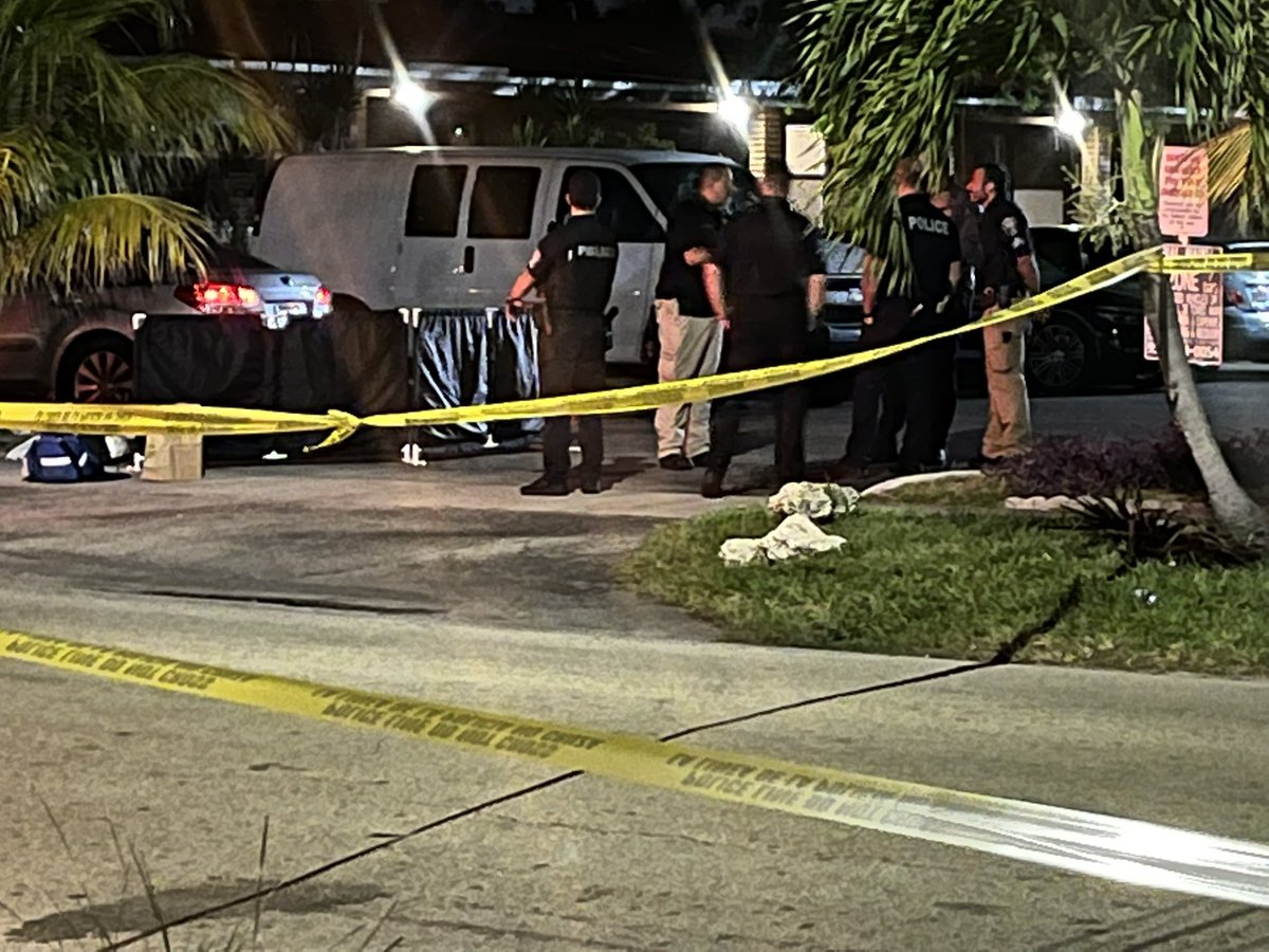 Police activity in a Hollywood neighborhood near Dixie HWY & Fillmore Street. Police are outside of what appears to be an apartment home &amp; surrounding a black tent on the ground