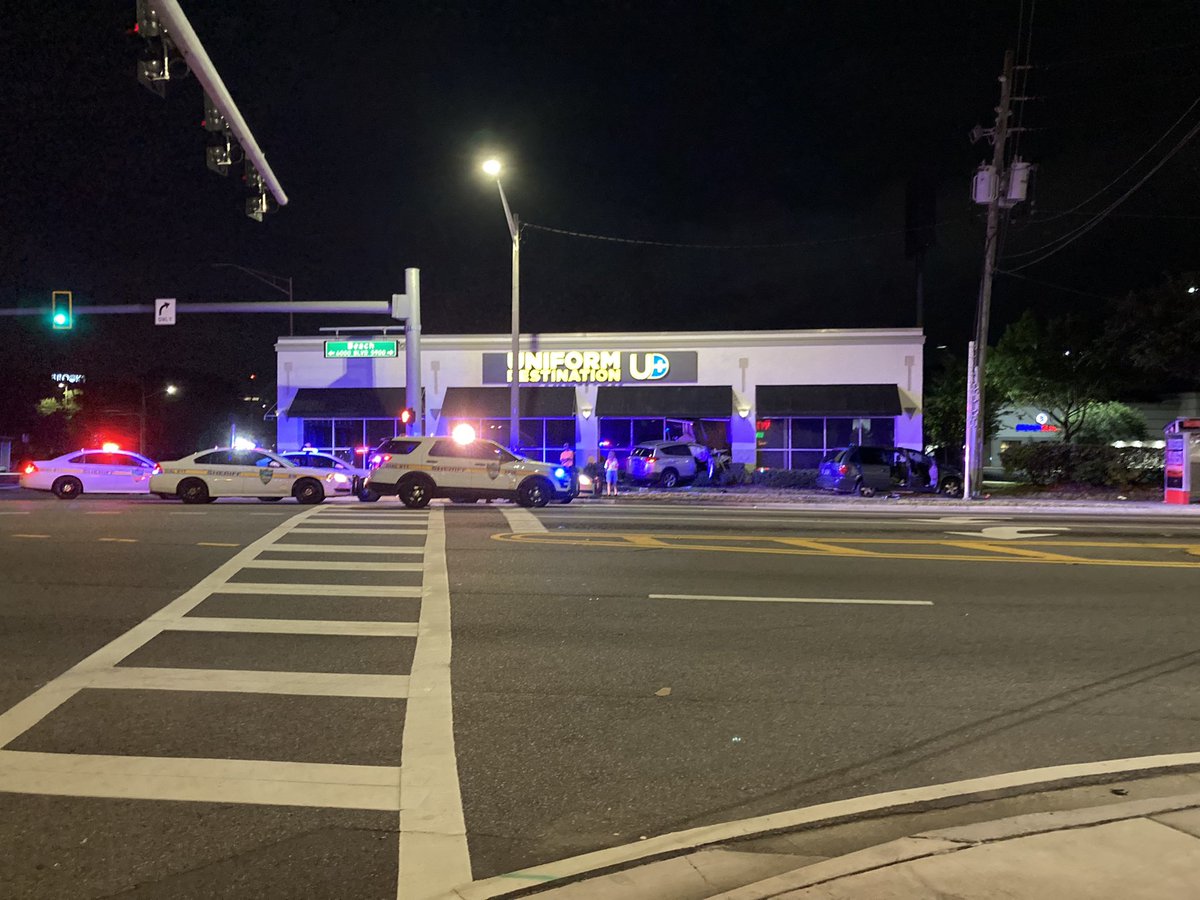 Car crashes into a SUV and then a building on Beach Blvd at University - 1 woman taken to the hospital and at least 1 person in custody 