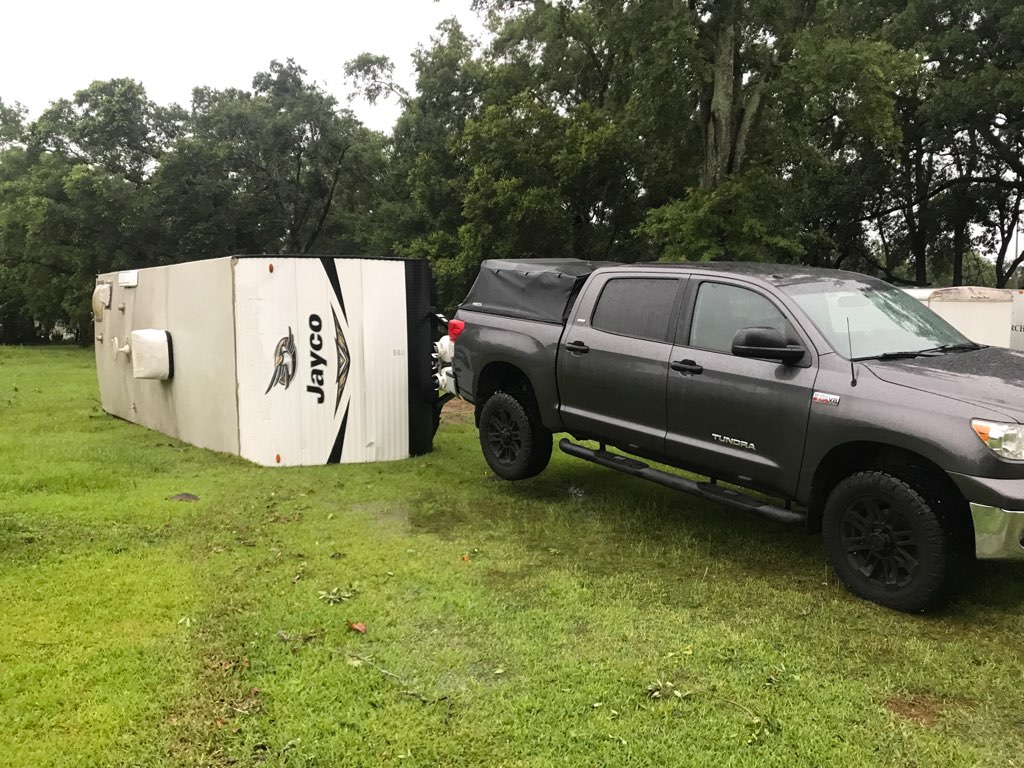 Images from Burning Tree Rd. near Scenic Hills Country Club show downed trees and power lines, as well as flipped trailers 