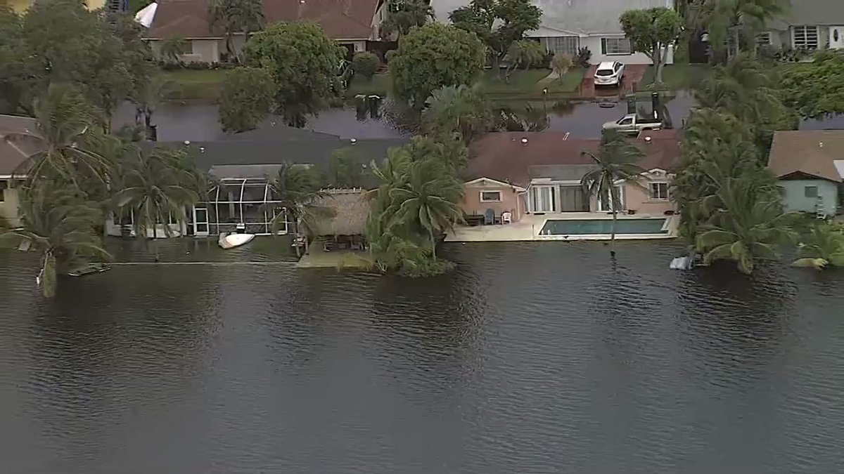 Flooding continued to plague South Florida Tuesday as drivers were seen driving in floodwaters in Cutler Bay