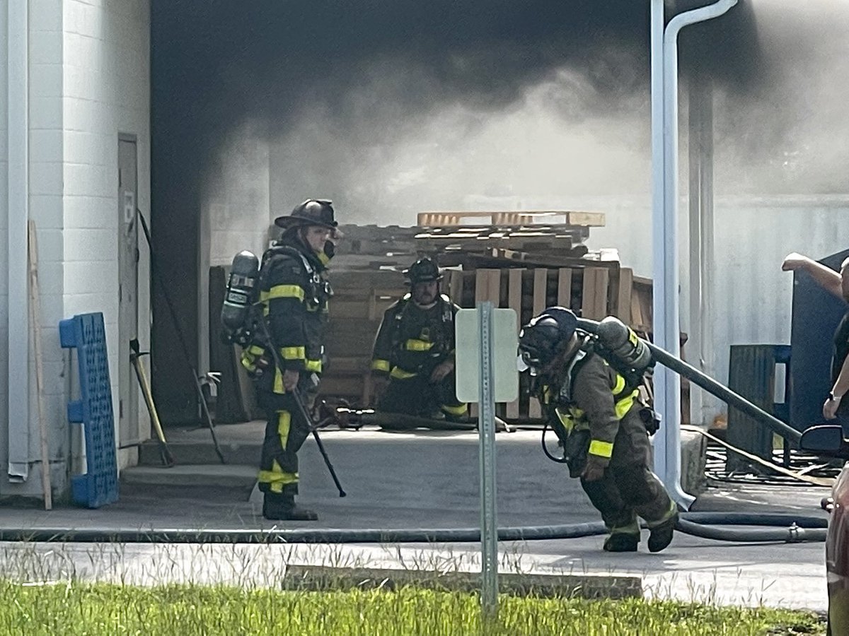 Crews working fire at Martelli Enterprises Warehouse on North W Street in Escambia County