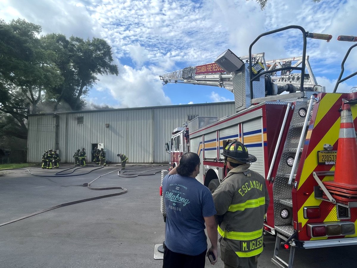 Crews working fire at Martelli Enterprises Warehouse on North W Street in Escambia County