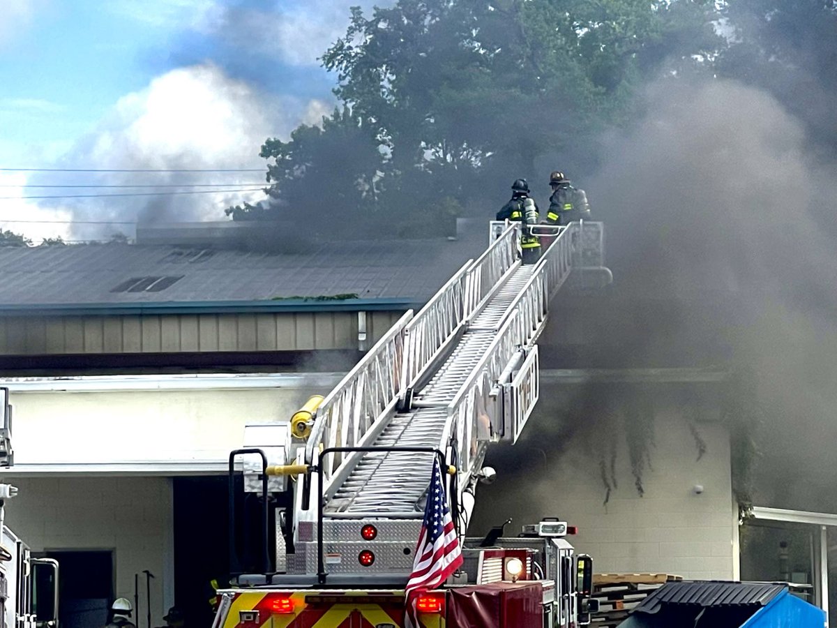 Crews working fire at Martelli Enterprises Warehouse on North W Street in Escambia County