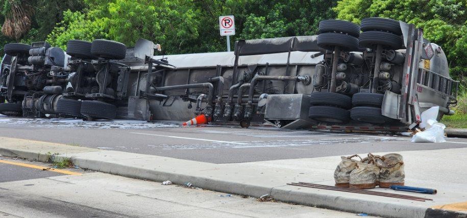 Hillsborough Troopers are investigating a tanker truck that overturned and spilled a large volume of gasoline along US-41 at Madison Ave - Driver uninjured - Road closed for extended period - Motorists should seek alternate routes