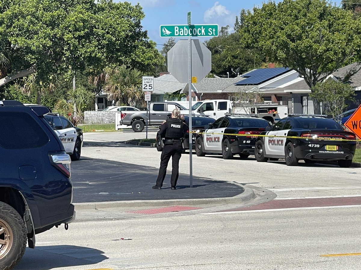 @MelbournePolice at scene 400 block of Poinciana Dr. Street blocked off. SWAT and command post set up. Officer on speaker heard asking occupant to come out. 