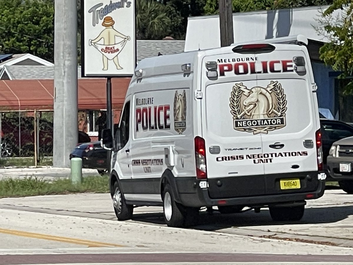 @MelbournePolice at scene 400 block of Poinciana Dr. Street blocked off. SWAT and command post set up. Officer on speaker heard asking occupant to come out. 