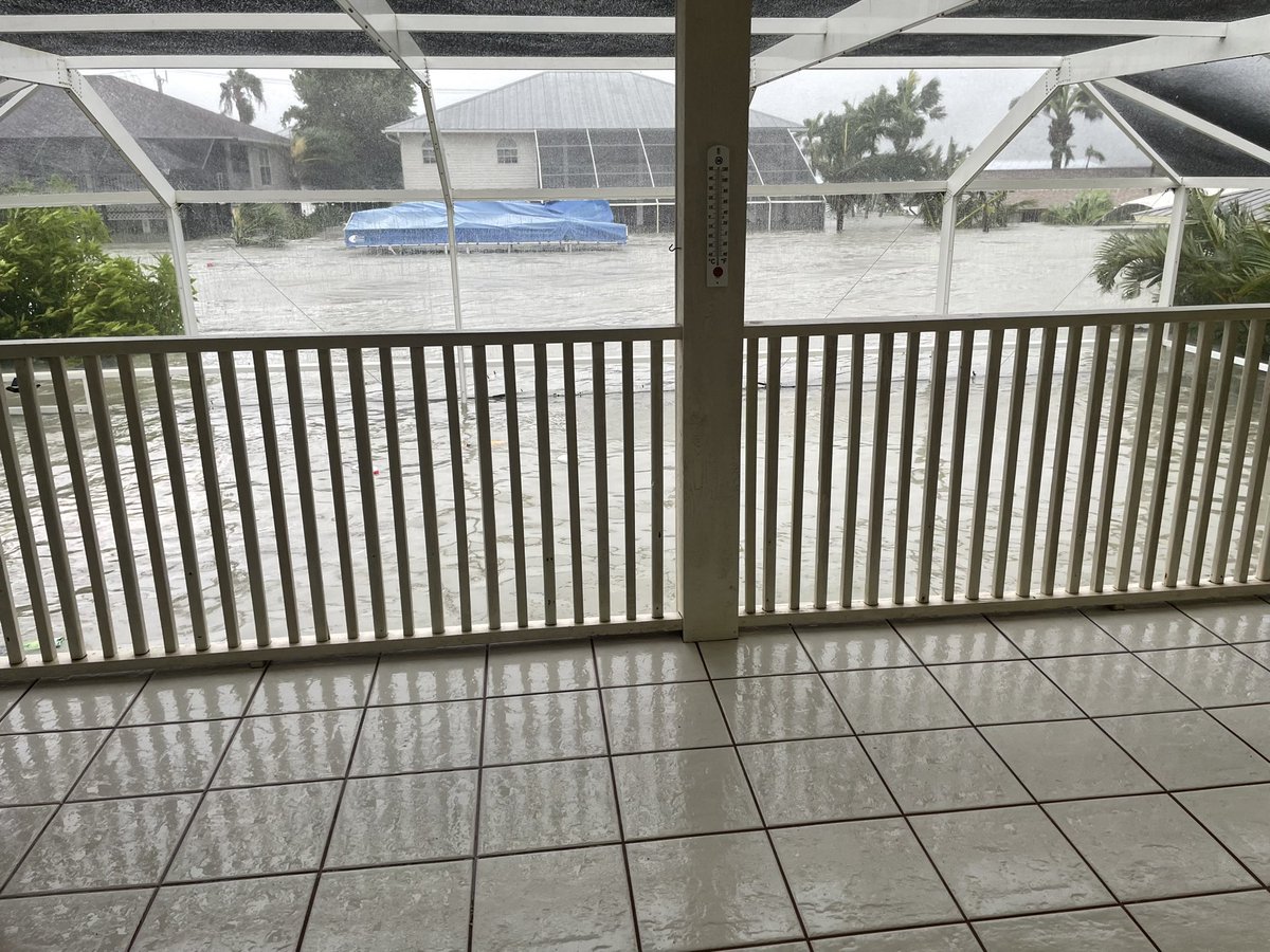 Threatening storm surgenear the roof of 1 story homes