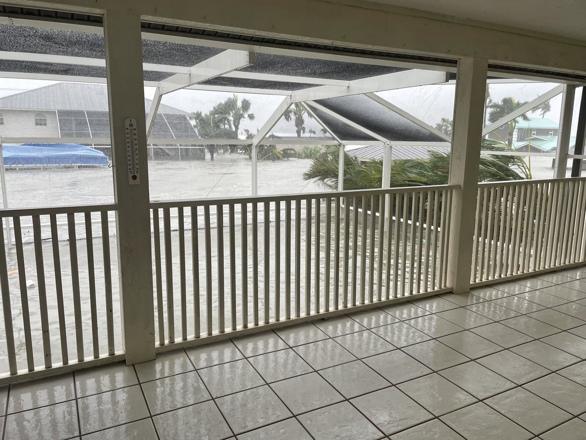 Threatening storm surgenear the roof of 1 story homes