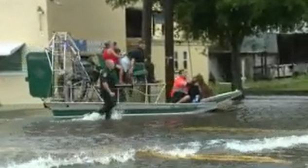 Dozens of people have been rescued from their flooded homes in Ft. Myers, FL 