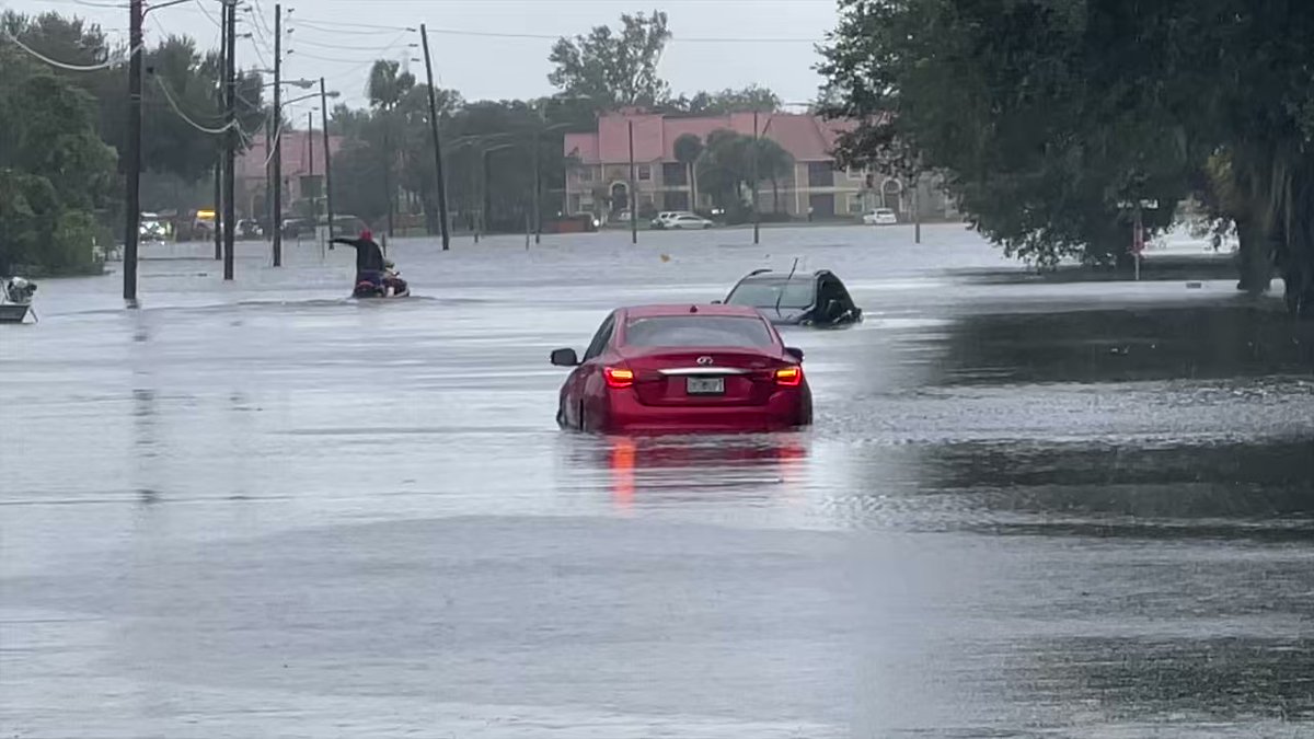 N Central Ave in Kissimmee is underwater, cars stranded. Emergency officials assessing situation.