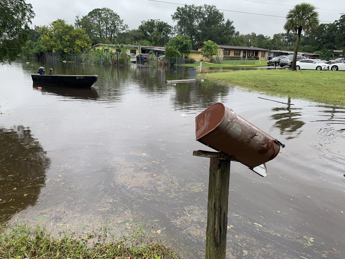 Orlo Vista is flooded. Notice how high the water has risen in comparison to cars and stop signs. It's risen to waist-deep in some homes.  People new to the neighborhood say they never could've imagined this. People who've been here a while say it just happened in Irma