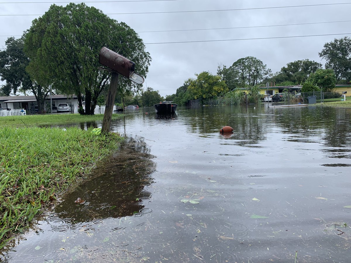 Orlo Vista is flooded. Notice how high the water has risen in comparison to cars and stop signs. It's risen to waist-deep in some homes.  People new to the neighborhood say they never could've imagined this. People who've been here a while say it just happened in Irma