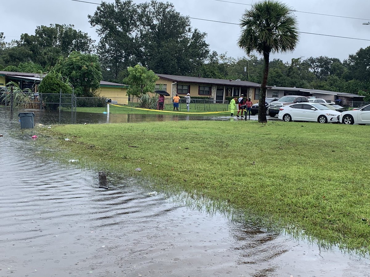 Orlo Vista is flooded. Notice how high the water has risen in comparison to cars and stop signs. It's risen to waist-deep in some homes.  People new to the neighborhood say they never could've imagined this. People who've been here a while say it just happened in Irma