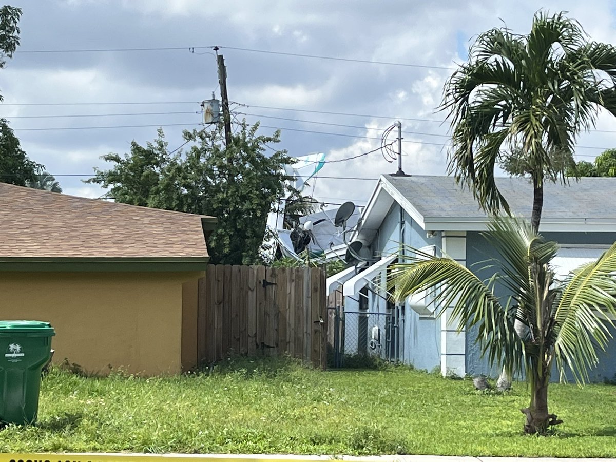 A plane has crashed into a Miramar backyard and two people are dead