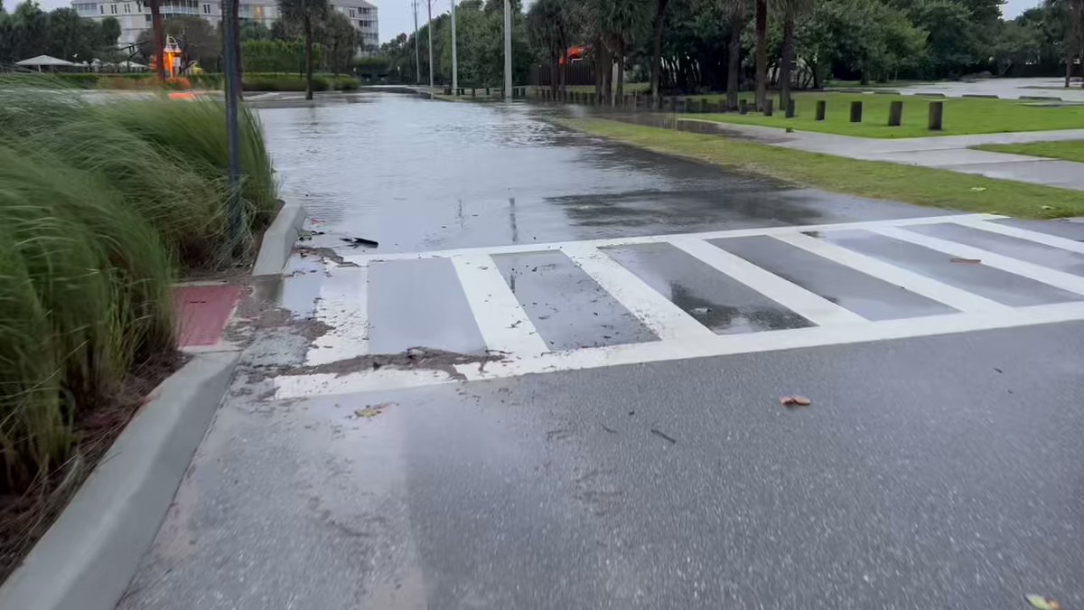 Minor flooding leftover from heavy rainfall earlier this morning in the parking lot of Stuart Beach