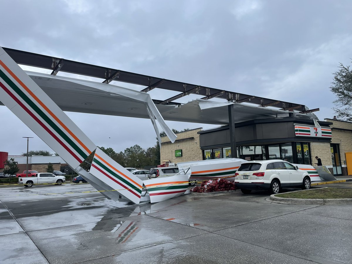 This 7-Eleven was damaged in the storm that hit Spring Hill  You can see part of it came down on the side of that white car