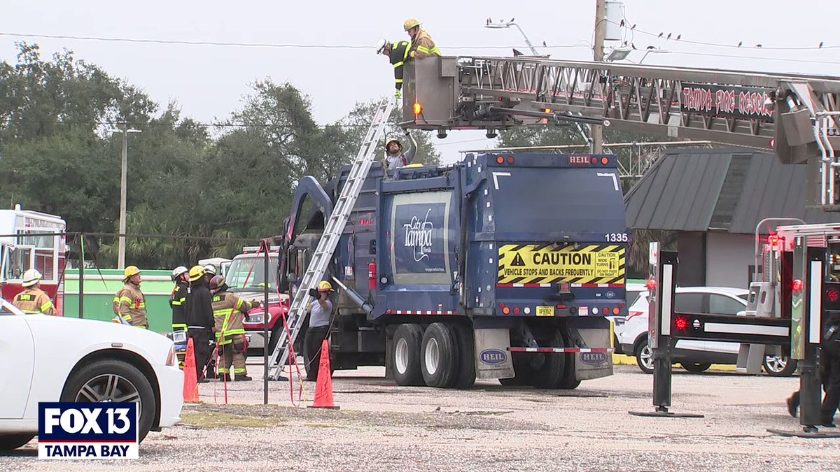 Tampa Fire crews rescued a man this morning after he was trapped in a garbage truck, presumably after being loaded from a dumpster. He was taken to the hospital with serious injuries.