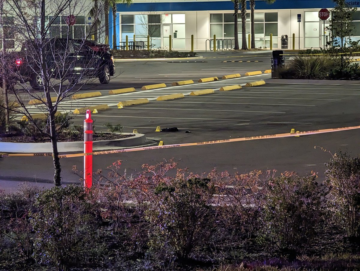 The @HCSOSheriff is working a possible shooting scene at the Amazon Hub off Harney Rd just north of Hillsborough Ave. There are evidence markers in the parking lot