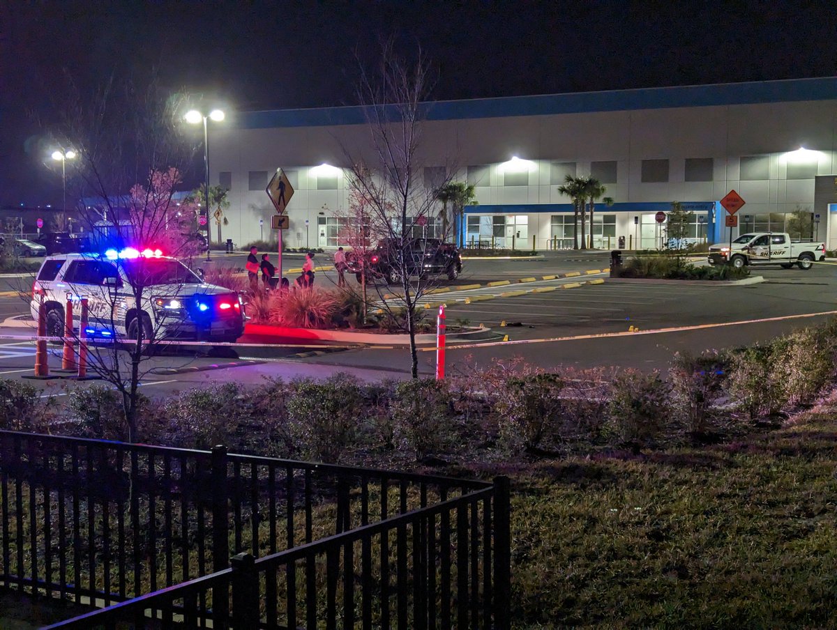 The @HCSOSheriff is working a possible shooting scene at the Amazon Hub off Harney Rd just north of Hillsborough Ave. There are evidence markers in the parking lot