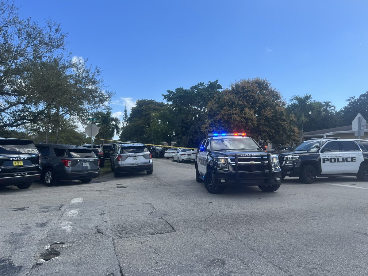 Police with long guns, face covers, and other SWAT gear surrounding an apartment complex in Hollywood where one man was shot. Neighbors on scene who had to evacuate tell they're working to get another person out