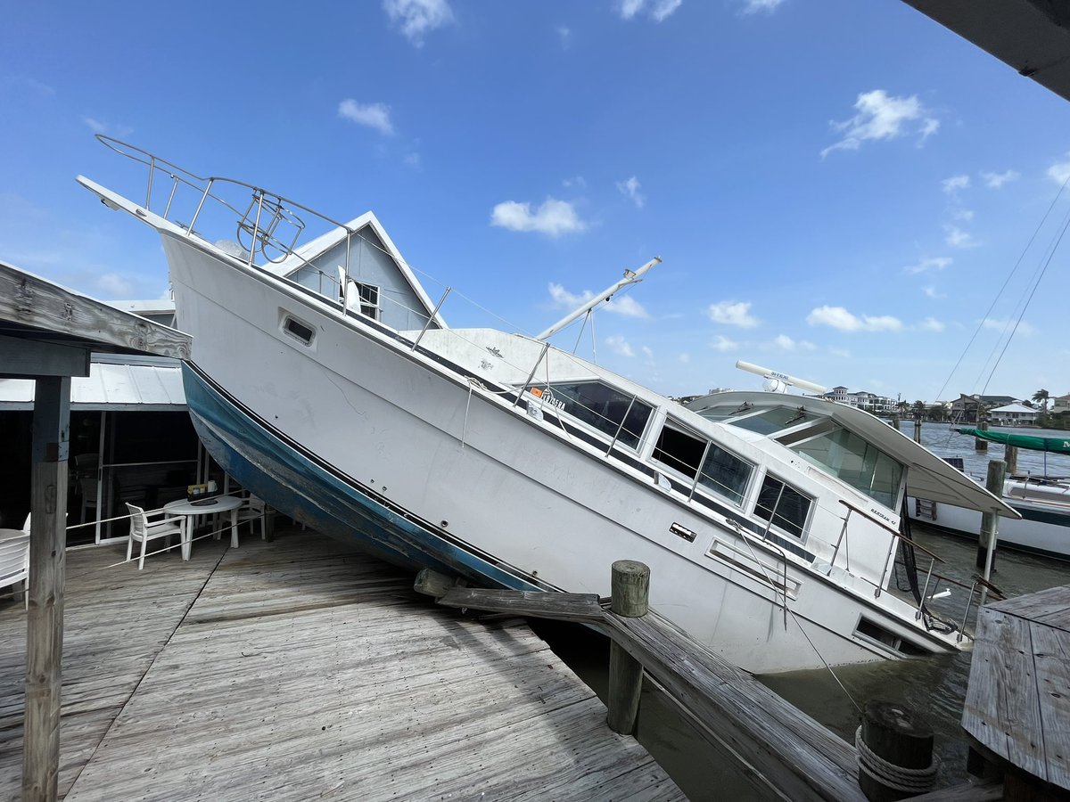 Idalia: Despite 2-4 feet of storm surge from Hurricane Idalia, this boat remains dislodged on the dock of this restaurant. The managers here at Bonita Bill's say it will take a crane to get this boat out of here 