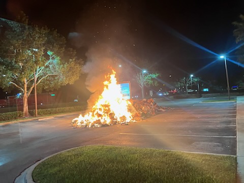 Garbage truck caught fire. The garbage truck driver dumped the contents in an empty parking lot away at the 8000 block of Commodity Dr. Crews from St 52 and 57 quickly worked together to put it out before it spread. Great job everyone