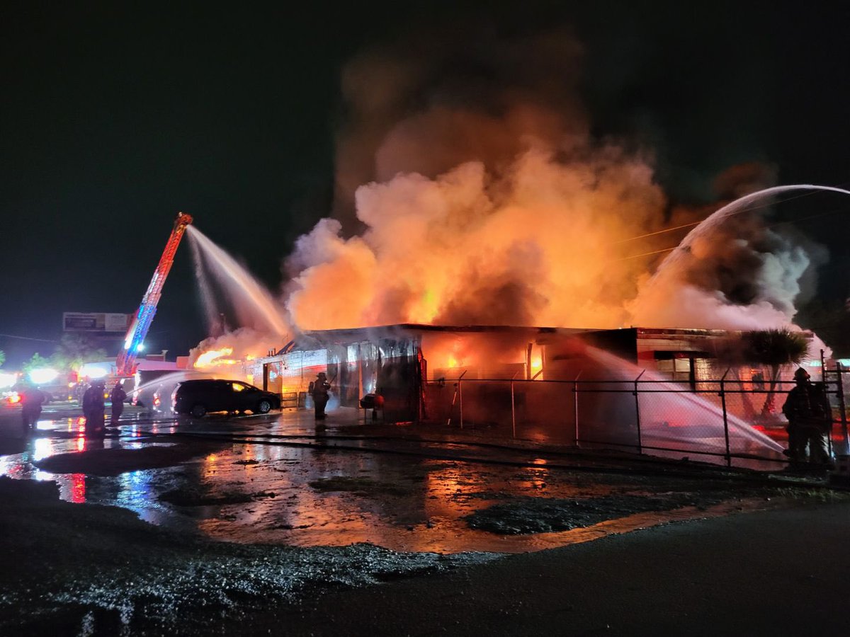 BuildingFire: Firefighters are working on putting out a 2 alarm building fire at an abandoned auto shop on the 6400 block of University Blvd. Heavy flames and smoke are showing