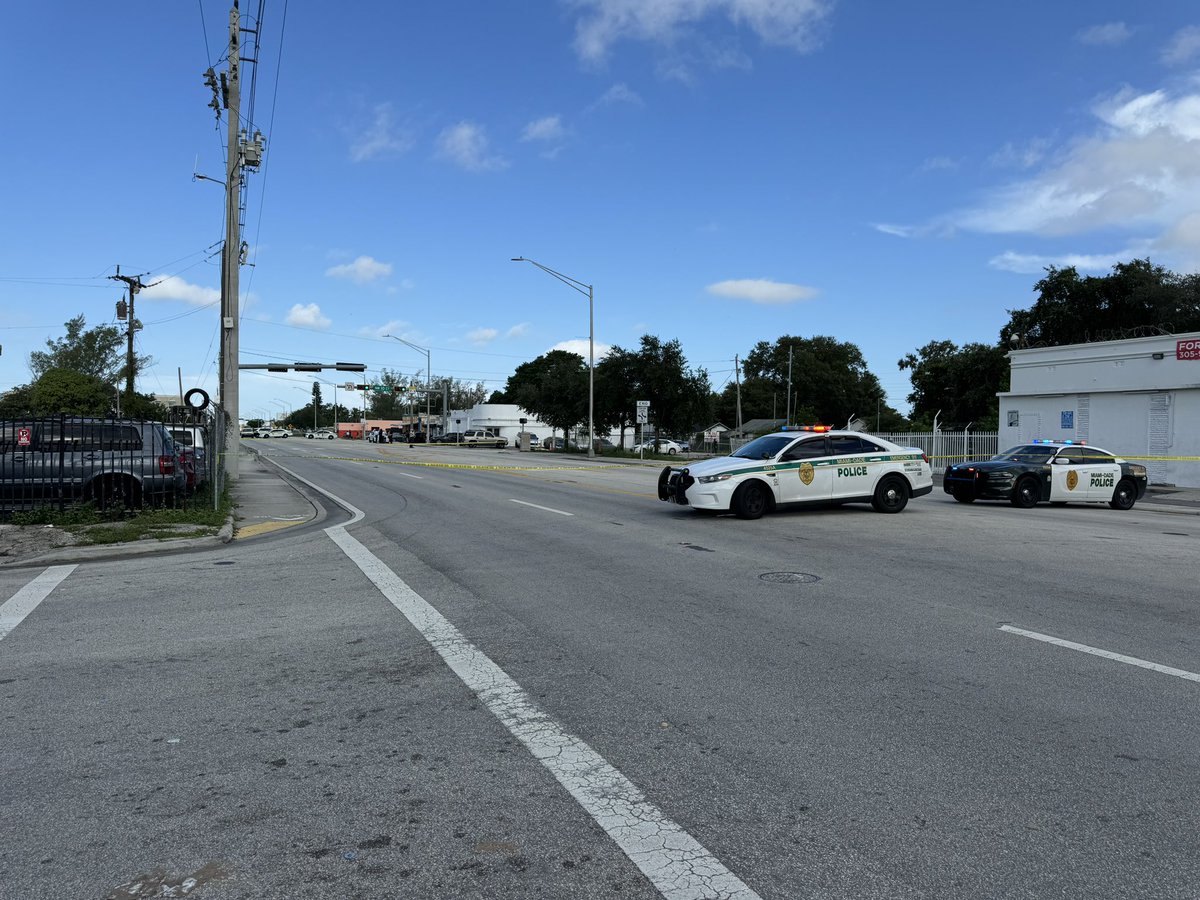 At least one person is dead after a shooting near Tropicana Bar on NW 79th St and  10th Court in Gladeview area. One body seen covered by tarp, several evidence markers on ground nearby. Police currently gathering evidence. 