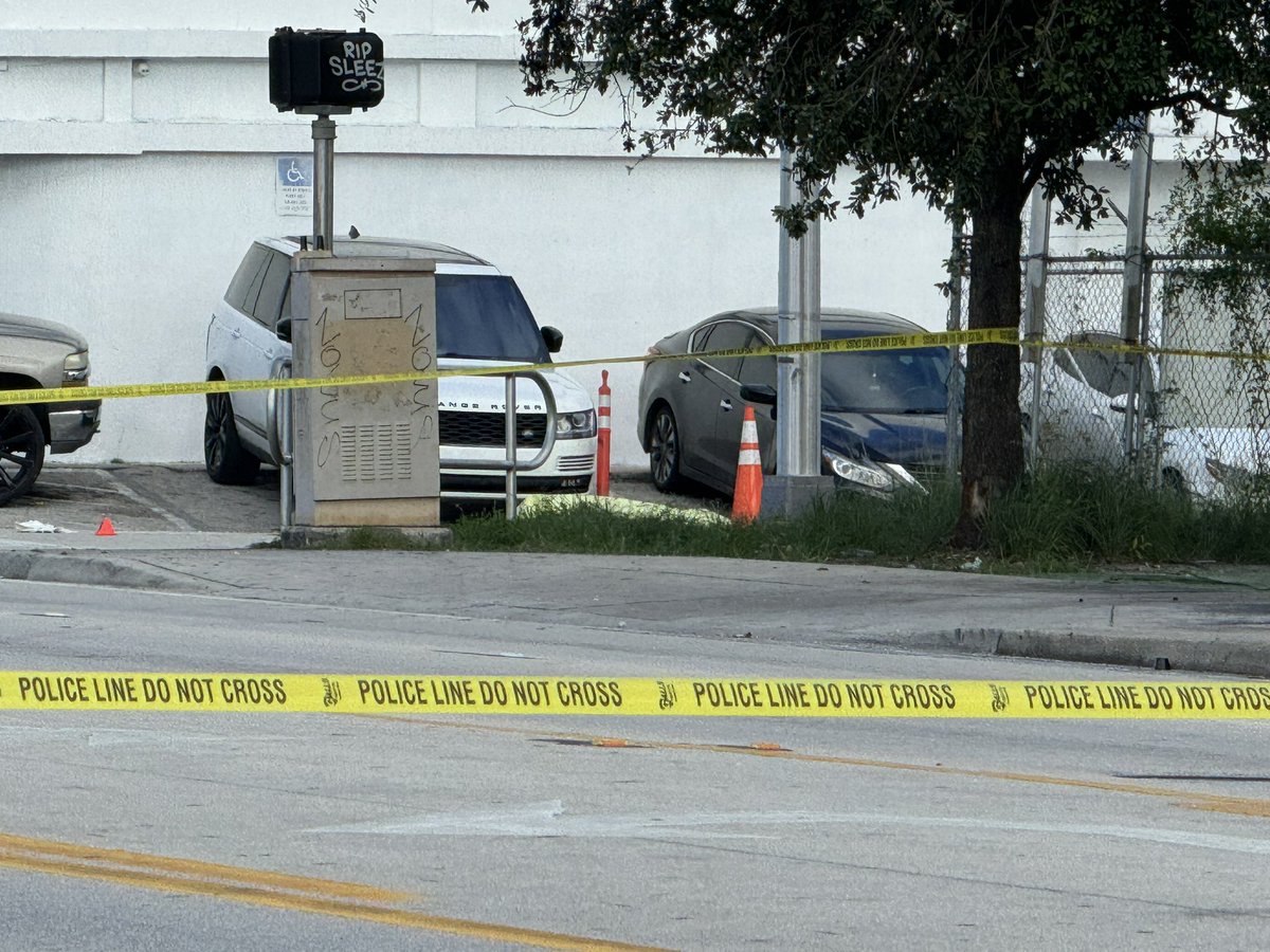 At least one person is dead after a shooting near Tropicana Bar on NW 79th St and  10th Court in Gladeview area. One body seen covered by tarp, several evidence markers on ground nearby. Police currently gathering evidence. 