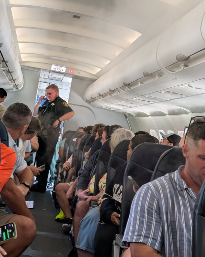 One person is in custody after an alleged bomb threat was made on an airplane leaving St. Pete-Clearwater International Airport