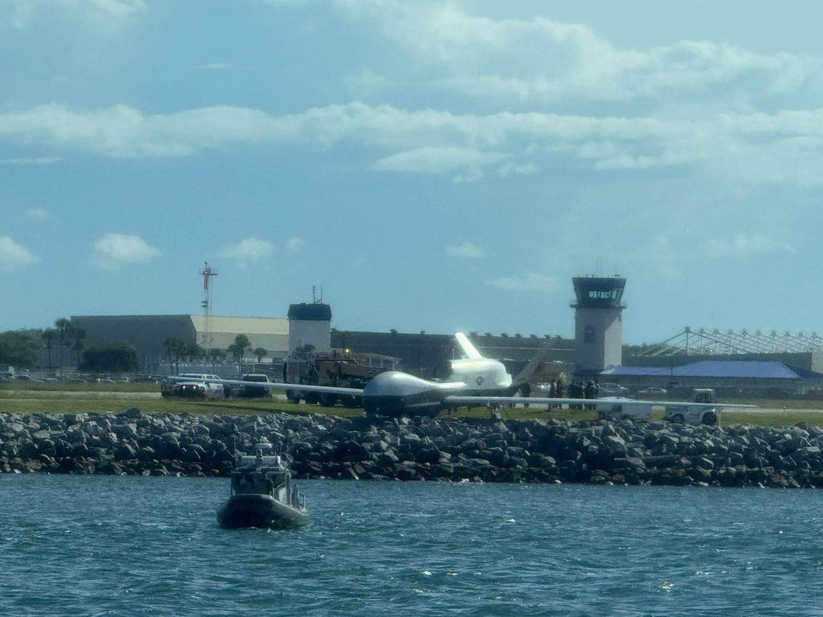 A U.S. Navy MQ-4C Triton surveillance drone ended up on the riverbank at the end of a runway at Naval Station Mayport, Florida, after what appears to be a landing overrun